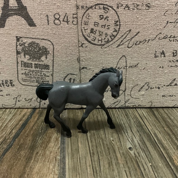 Other - A grayish black horse from spirit with a black tail and mane